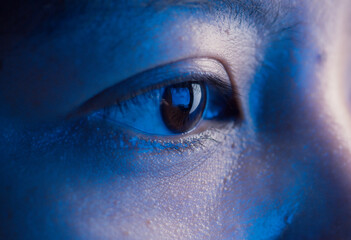 Young Asian woman eyes looking at monitor, Monitor blue light is reflected in her eyes,effects on...