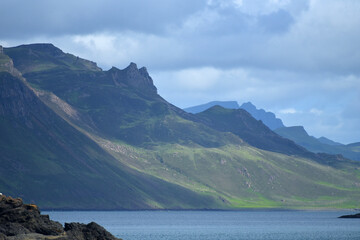 Fototapeta na wymiar Quiraing range across Portree Bay from the Braes, Isle of Skye, Inner Hebrides, Scotland