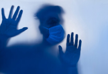 A young man quarantined in isolation during the pandemic.