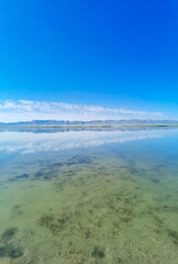 Reflection on Song Kul lake in Kyrgyzstan 