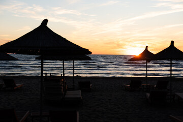 Evening view of the sea with sun loungers