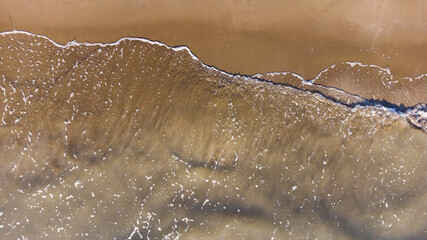 Soft wave of the sea on the sandy beach