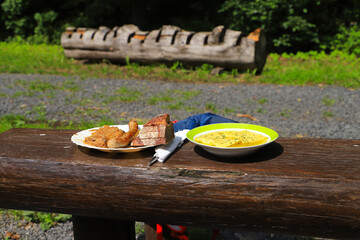 Traditional food on a resting place(sausage, swabian vegetable ravioli) in Rhoen mountains, Germany