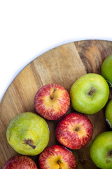 Red and Green apples on cutting board