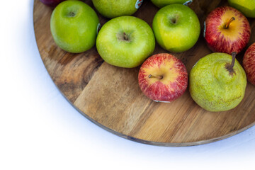 Red and Green apples on cutting board