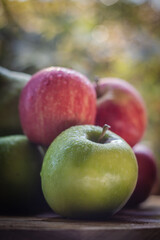Fototapeta na wymiar Apples and Pears on Natural wood