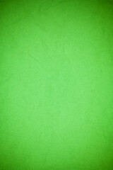 Crumpled green paper background.