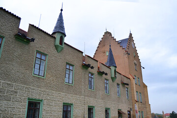 Wall of medieval Žleby castle (Zámek Žleby) on rainy autumn day. Žleby, The Central Bohemian Region, Czech Republic