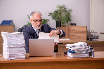 Old male employee and too much work in the office