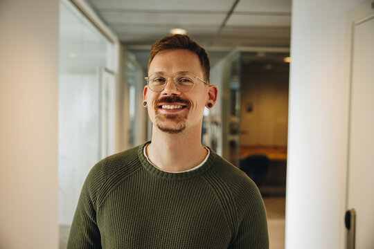 Portrait of smiling entrepreneur in office