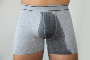 Man with wet briefs because of urinary incontinence