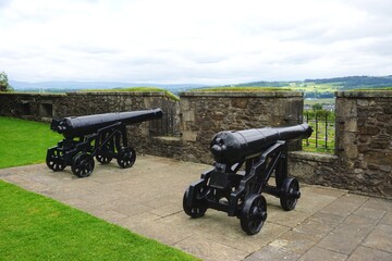 Vintage restored cannons on castle ramparts in rural Scotland