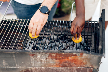 Multiethnic friends doing barbecue meal party outdoors at backyard