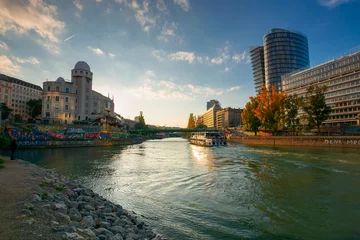 Foto auf Acrylglas Antireflex vienna, austria - OCT 17, 2019: cityscape of vienna with danube channel. beautiful urban scenery in evening light. gorgeous sky above the skyline © Pellinni