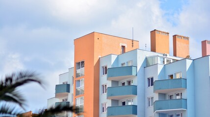 Modern colorful facade of a residential building with large windows. View of modern designed...