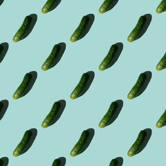 Fresh cucumbers on a blue background. Pattern of cucumbers. Top view. Banner. Pop art design, creative summer food concept. Green cucumbers, minimal flat lay style. - 448721059