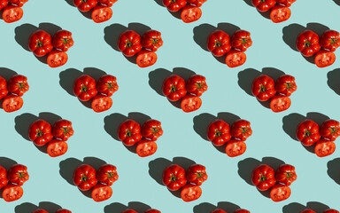 Red tomatoes pattern on a blue background, flat lay. Tomato wallpaper, vegetable pattern, pop art composition.Top view.  - 448721271