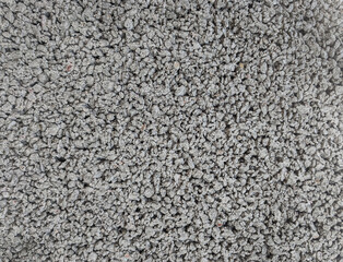 Gray and white marble chips. Monochrome. Natural  Granite Chippings, Macadam, Rubble or Crushed Stones Background. Top view Broken Stone or Crushed Rock Texture with Place for Text