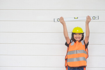 Asian girls pretending to be a construction worker