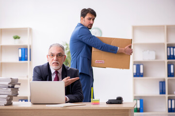 Two male employees in dismissal concept