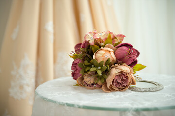 Purple rose bouquet for the bride on her special day. Wedding bouquet of flowers with lace