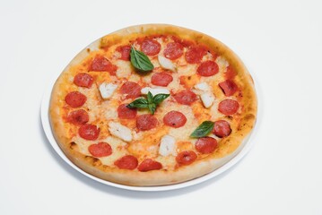 Delicious italian pizza over white background top view