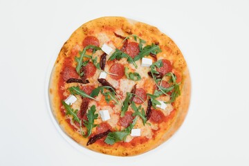 Delicious italian pizza over white background top view