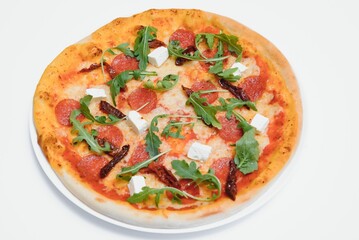 Delicious italian pizza over white background top view