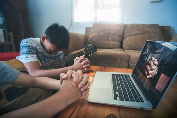 Two boy praying of christian with computer laptop, Online live church for sunday service, small...