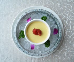 chilled mango pudding with mango puree soup dessert in white background asian halal menu