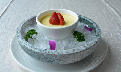 chilled mango pudding with mango puree soup dessert in white background asian halal menu