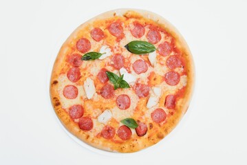Delicious italian pizza over white background top view