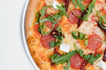 Delicious italian pizza over white background top view