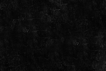 Cracked texture of the black stone wall