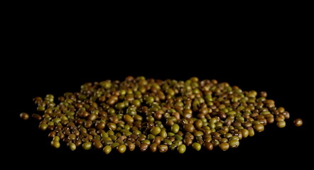  Green mungo beans pile (Vigna radiata) isolated on black background