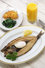 kipper(smoked herring) and poached egg, traditional British breakfast dish