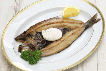kipper(smoked herring) and poached egg, traditional British breakfast dish