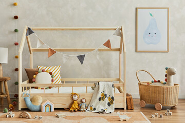 Stylish composition of cozy scandinavian child's room interior with wooden bed, plush and wooden toys, rattan basket and textile hanging decorations. Creative wall, carpet on the floor. Template.