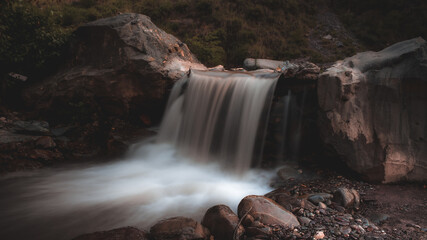 long exposure shot of waterfall in the forest