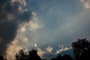 Clouds and sunrays in the sky