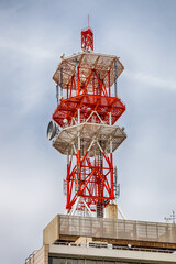 Fototapeta na wymiar Communications tower with a beautiful blue sky