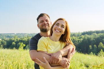 Portrait of happy adult couple on summer sunny day