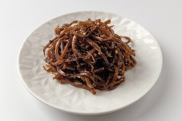 stewed burdock on a white background