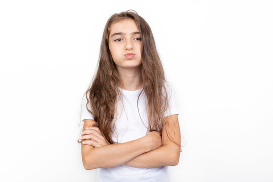 Portrait of angry or bored girl. A little cute Girl is sulking. 