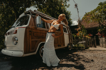 Beach Lifestyle Surfer Girl next to Vintage Surf Van