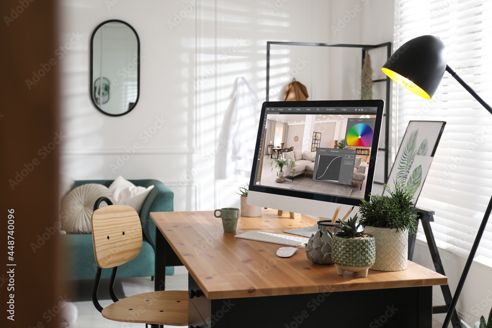 Aufkleber designer's workplace. computer with photo editor application on table indoors