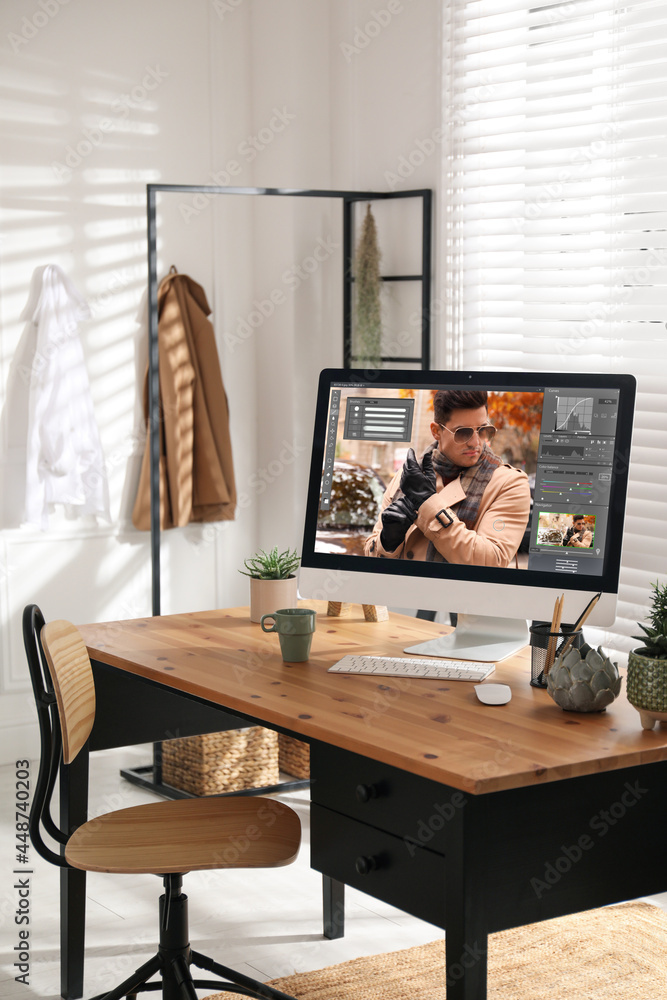 Aufkleber designer's workplace. computer with photo editor application on table indoors