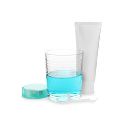 Mouthwash, dental floss and toothpaste on white background