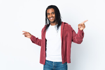 Delivery African American man with braids isolated on white background pointing finger to the laterals and happy