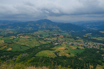 Aerial view of landscape with fields, mountains, woods, and blue sky. natural background.